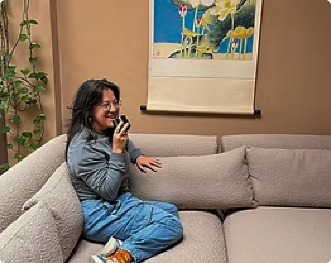 A patient relaxing on the sofa in the Felice Acupuncture clinic